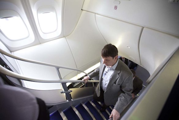 EVERETT, WA - MAY 1: A visitor makes his way up stairs on the Boeing 747-8 Intercontinental.
