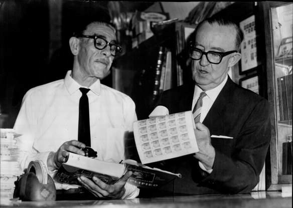 "Mr G. Croyston and Mr. B. Moloney checking through some stamps in their city store this week."
