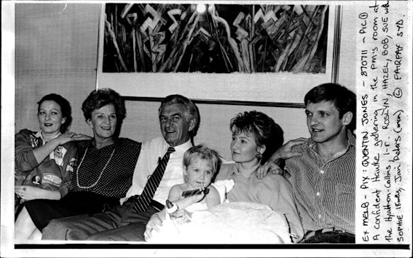 The Hawke family (from left) Roslyn, Hazel, Bob, Sue (with daughter Sophie) and her husband Jan Dieters, gathered together to savour the sweet taste of victory on election night in the PM's suite at the Hyatt-on-Collins hotel in Melbourne. July 11, 1987. 