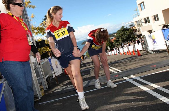 The Humpty Dumpty Foundation's Balmoral Burn run. Laurel Donnelly and Jemima Mcgahey cross the line in the girls 'Head of The Hill' relay event.