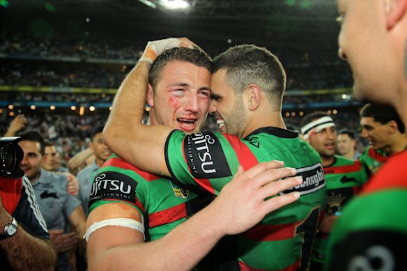 Sam Burgess cries as he is embraced by Greg Inglis after the 
Rabbitohs defeated the Bulldogs to claim the 2014 NRL Premiership.