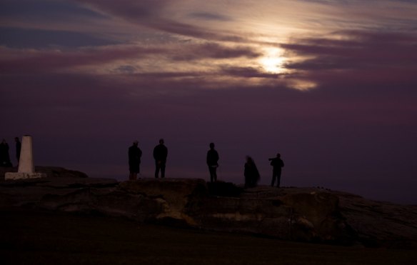 Observing social distancing and waiting for a full moon to emerge in Maroubra, May 7, 2020