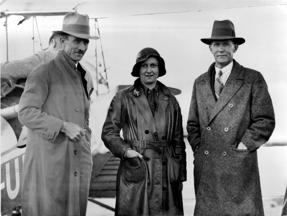 “Ready To Fly - Mr. H. B. Bonney (left), Mrs. Bonney, and Mr. F. Bonney (cousin of Mr. H. Bonney) snapped just before Mrs. Bonney left on her round Australia flight. ”