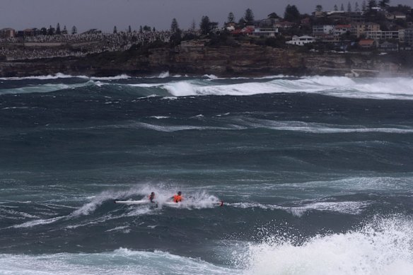 Kayakers brave large waves at Bondi as damaging southerly winds hit Sydney.