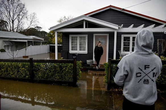 Camden residents Jai and Belinda Prestwidge evacuate their home.