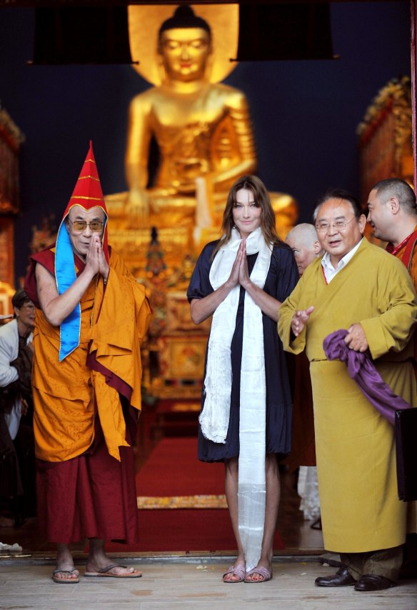 Sogyal Rinpoche (right) in 2008 with the Dalai Lama and Carla Bruni-Sarkozy.