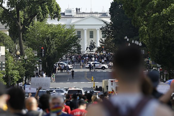 Demonstrators gather to protest the death of George Floyd near the White House in Washington DC.