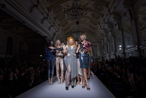 Designer Vivienne Westwood takes the applause after her show during London Fashion Week, in London, Sunday, Sept. 19, 2010.