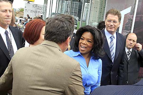Talk show queen Oprah Winfrey appears in Federation Square with Prime Minister Julia Gillard and Victorian Premier Ted Baillieu.