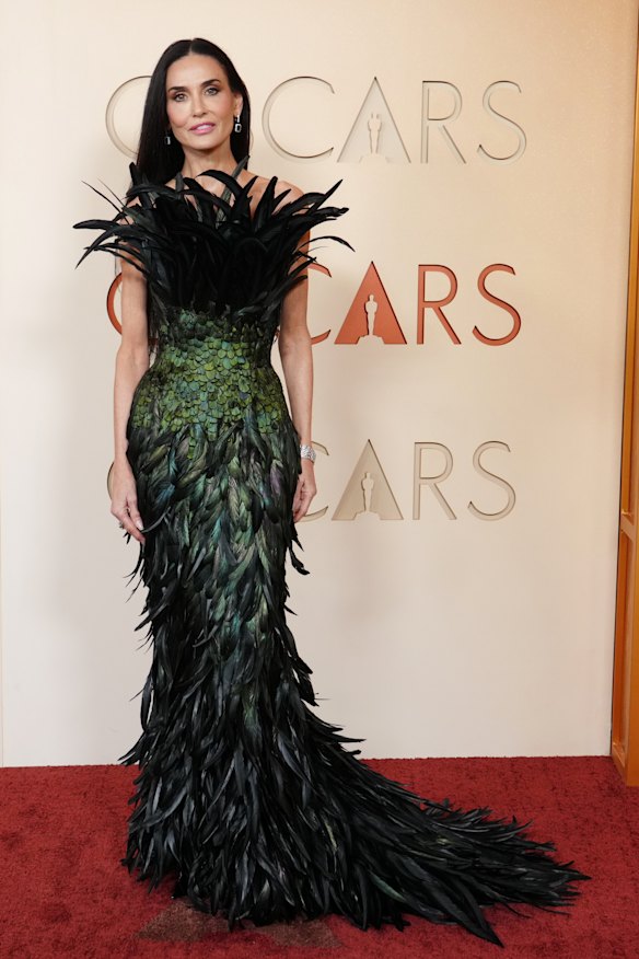 Demi Moore turned heads in a feathered gown.