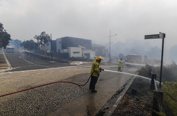 Firefighters work to control the fire. 