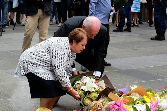 Governor General Peter Cosgrove and wife Lynne lay flowers at Martin Place. 