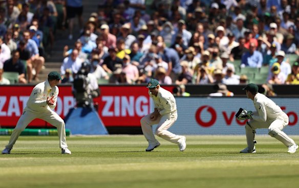 David Warner (C) of Australia catches out Joe Root of England.