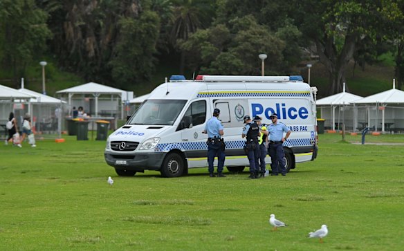 Police are seen where huts are fenced off as a precaution against COVID-19 on New Years Eve at Bronte Beach in Sydney.
