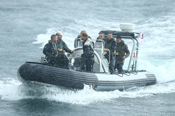 Prince Harry arrives by boat at Campbells Cove on June 7, 2017 in Sydney, Australia.