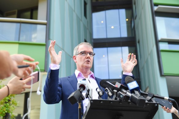 NSW Opposition leader Michael Daley speaks to media outside the troubled Opal Tower at Sydney Olympic Park.