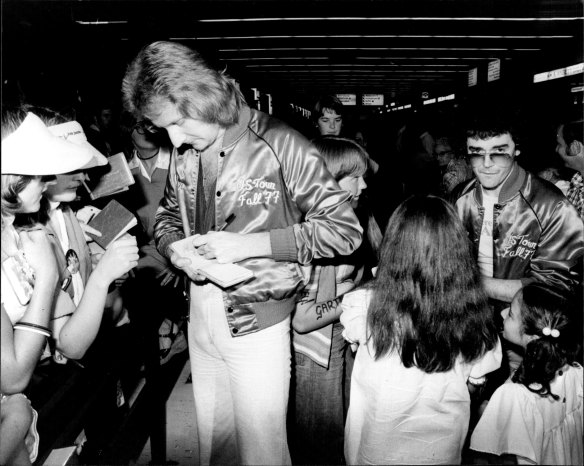 Graham Russell and Russell Hitchcock of Air Supply greet the fans at Sydney Airport.
