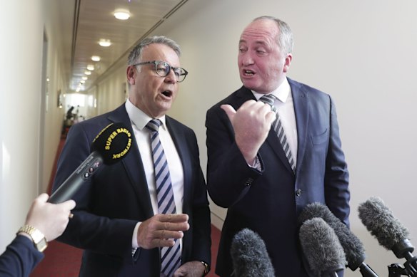 Labor MP Joel Fitzgibbon and Nationals MP Barnaby Joyce having a heated discussion after Fitzgibbon gatecrashed Joyce's doorstop interview in the press gallery, at Parliament House in Canberra.