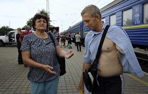 Viktor Telsenko 57 (right) who lost his left arm five days earlier when an artillery shell exploded next to his house in the village of Mykolaivka waits to board the Medecins Sans Frontieres medical evacuation train with his wife Svetlana (left) in Pokrovsk, Ukraine. 