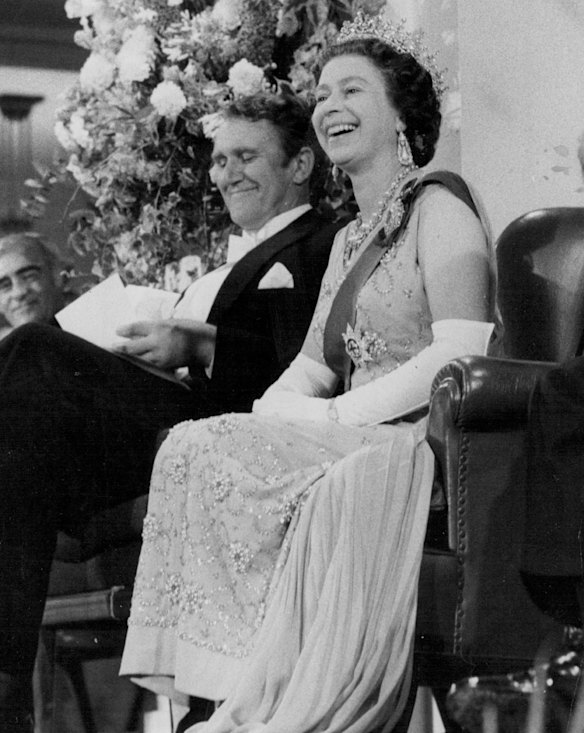 The Queen laughs during Mr. Whitlam's speech on Wednesday (8-3-77). Sitting next to her is Australia's Prime Minister Mr. Malcolm Fraser.  14 March 1977