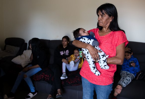 Lee-Anne Ebsworth with her grandson, Gordon, in the public housing home of her mother in Dubbo. Her family lived in the Gordon Estate during the 2006 riots and were forced to move afterwards when the government bulldozed dozens of homes and sold others. Since then her family is scattered over Dubbo, and  Lee-Anne remains homeless after being denied another public housing home. She spends her time staying with relatives. 