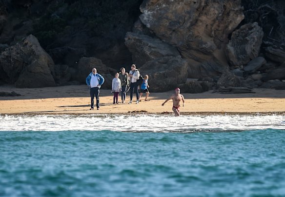 Grant enters the water at Point Lonsdale to swim across the rip to Point Nepean. 