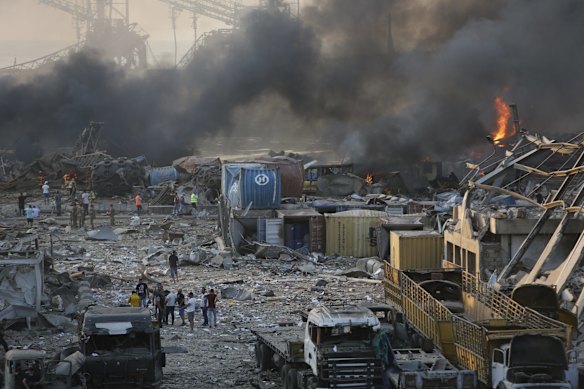 Smoke rises from a port facility after large explosions on August 4, 2020 in Beirut, Lebanon. At least 50 people were killed and thousands more injured when two explosions occurred near the Lebanese capital's port area.  