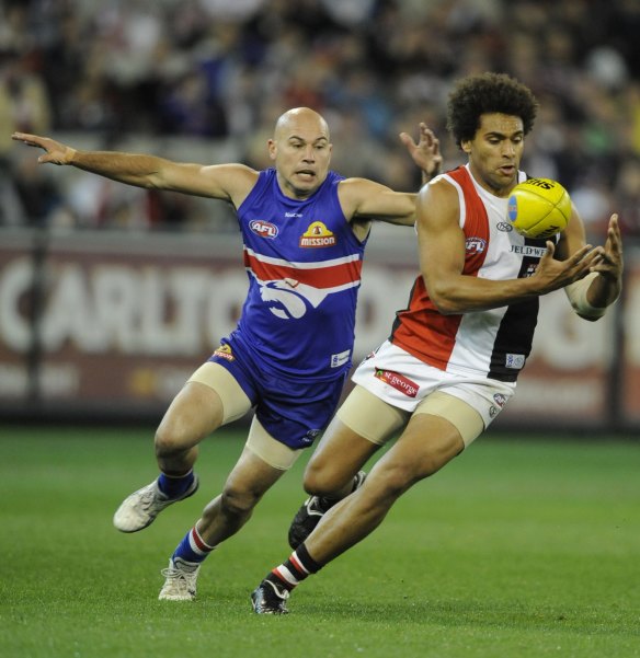 Bulldogs midfielder Nathan Eagleton chases St Kilda's James Gwilt during the 2010 preliminary final.