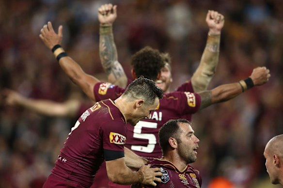 Cameron Smith and Cooper Cronk of the Maroons celebrate winning game three of the State Of Origin series.
