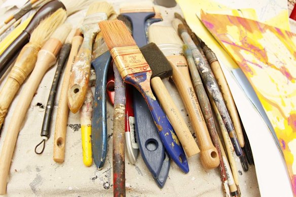 John Olsen's brushes waiting to be used during work on Mr Olsen's largest commissioned work, which will be hung in Melbourne.
