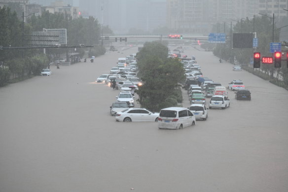 Vehicles are stranded in floodwater near Zhengzhou Railway Station in central China’s Henan province.