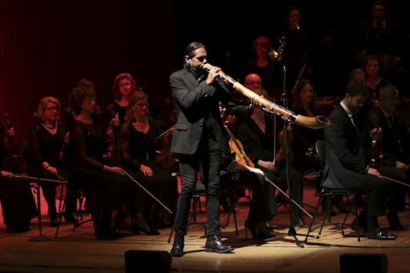 William Barton playing the didgeridoo together with the Sydney Symphony Orchestra playing 'Down Under' during the state memorial service for former Prime Minister Bob Hawke at the Sydney Opera House on Friday 14 June 2019.