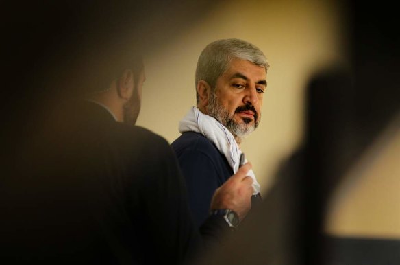 Khalid Mishal is informed of an incoming phone call on his mobile as he works out in a friends private gym in Doha, Qatar.