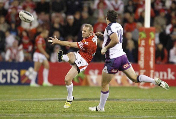 Dragons captain Ben Hornby punts the ball.