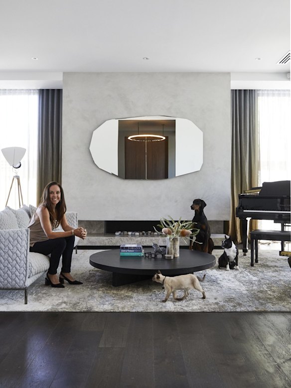 “The kids all play instruments and Jeff plays the guitar, so this has become the family music room,” says Janine. The sofa is from Hub and the mirror from Space Furniture.