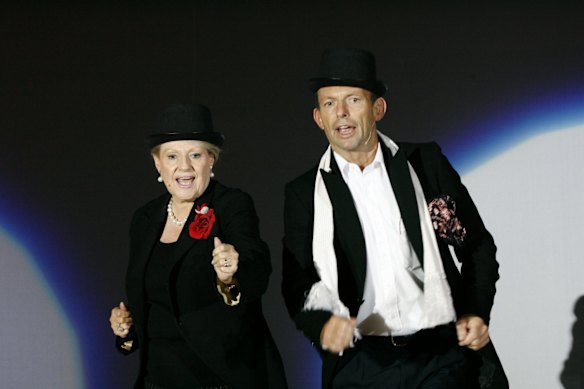 Federal MP's Bronwyn Bishop and Tony Abbott sing and dance during a rehearsal of  We're Couple of Swells from the musical Easter Parade for a charity fund raising event for the Millennium Foundation for medical research associated with Westmead Hospital. 