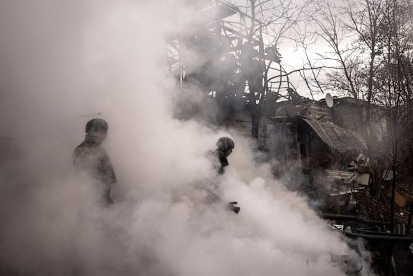 Firefighters work to extinguish warehouse blaze, caused by recent Russian shelling in Kharkiv. 