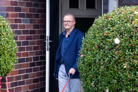 Anthony Albanese leaving his house.