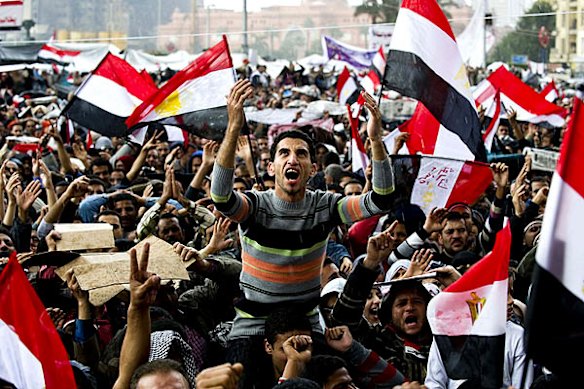Egyptian anti-goverment protesters shout slogans against President Hosni Mubarak.