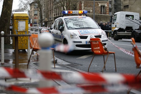 Police, paramedics and firefighters at the scene of the shooting in the south Paris on Thursday, January 8. 
