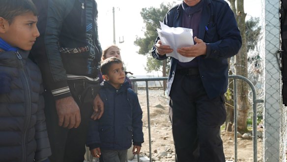Familes waiting to cross the border.