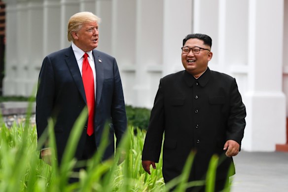 U.S. President Donald Trump and North Korea leader Kim Jong Un walk from their lunch at the Capella resort on Sentosa Island.