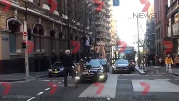 The man jumped onto the roof of car in Sydney's CBD.