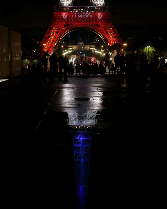 The Eiffel Tower was cast in the red white and blue of the French tricolour.