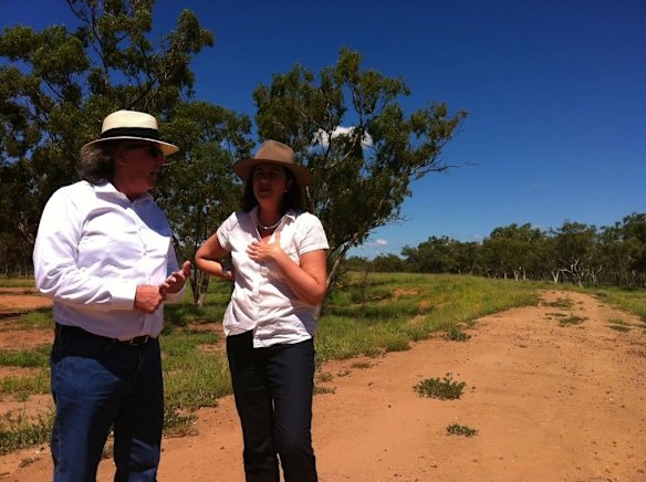 Warrego candidate Mark O'Brien and Annastacia Palaszczuk on the levee protecting Charleville.