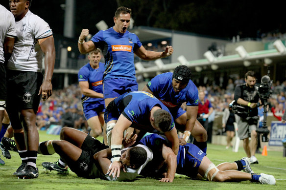 Back in action: Force players celebrate a try by Brynard Stander during their win over Fiji.