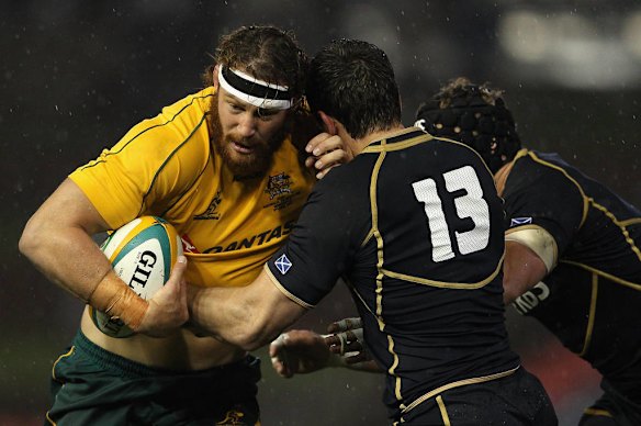 Scott Higginbotham of the Wallabies is tackled during the International Test match between the Australian Wallabies and Scotland at Hunter Stadium on June 5, 2012 in Newcastle, Australia.