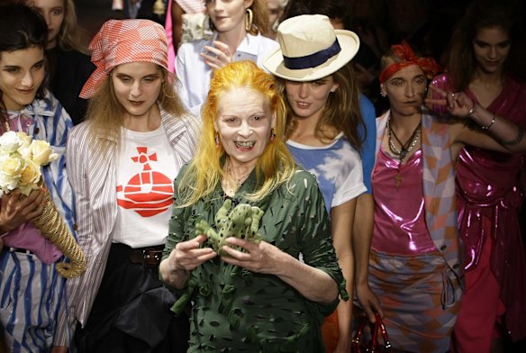 Fashion designer Vivienne Westwood poses with models after her 2010 Spring/Summer red Label collection show during London Fashion Week, September 20, 2009.  
