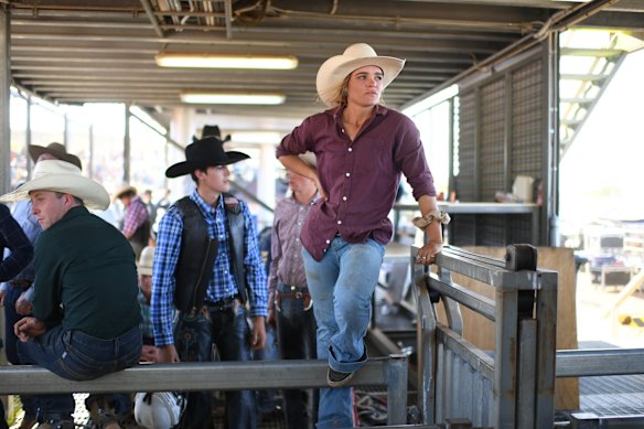 Stock Contractor Dakota Brandenburg looks on as she waits behind the chutes for a bull ride event to start at the Mount Isa Mines Rodeo in Mount Isa, Australia. Dakota Brandenburg, 25, is one of very few female rodeo stock contractors in the world. Dakota comes from family with a rich rodeo history - her father Darren "Brandy" Brandenburg is a former Australian Bull Riding Champion and All Round Champion cowboy while her mother Bridget is also an Australian champion in All Round Cowgirl and Barrel Racing. The Brandenburgs are one of Australia's leading stock contractors, breeding and supplying bulls for Professional Bull Riding events across New South Wales, the Northern Territory and Queensland, including the Mount Isa Mines Rodeo, the largest rodeo in the Southern Hemisphere.