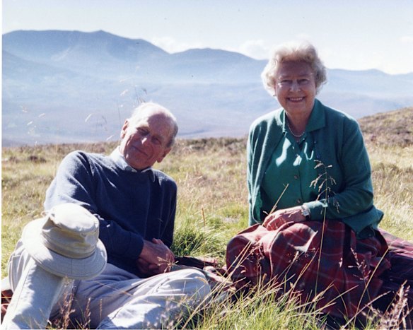 Queen Elizabeth II and Prince Philip, Duke of Edinburgh posing in a personal photograph at the top of the Coyles of Muick, taken by The Countess of Wessex in 2003.